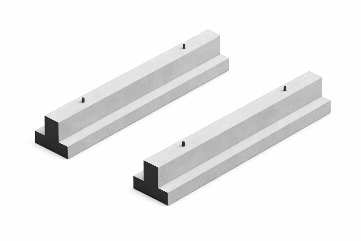 Two precast concrete cattle guard foundations side by side before installation